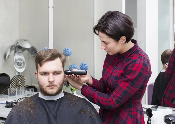 Young man at the hairdresser