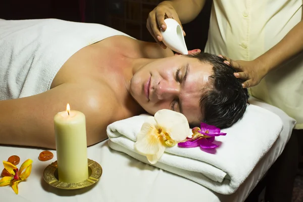 Man engaged in Ayurvedic spa treatment