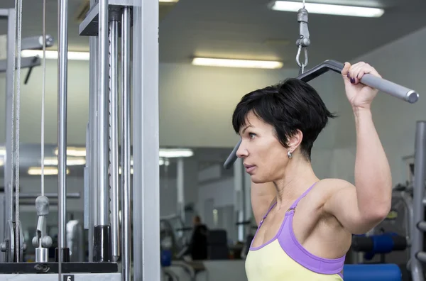 Bodybuilder exercising in gym