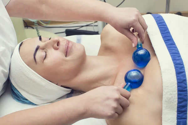 Woman on face massage procedure