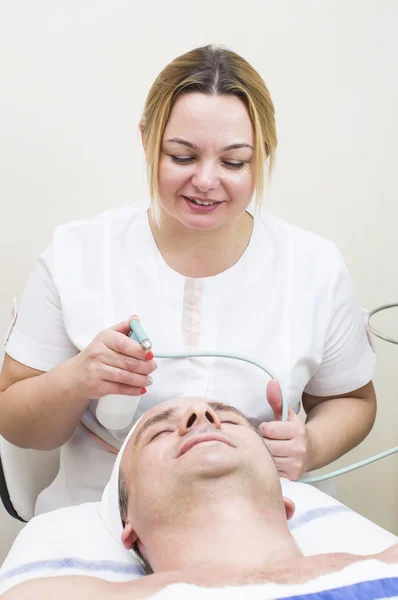 Man during facial treatment