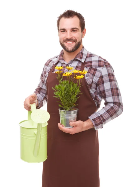 Gardener with flower and watering can