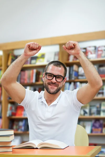 Happy man in the library