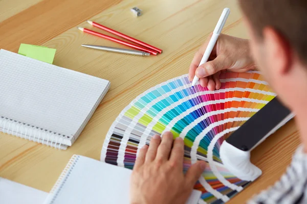 Graphic designer choosing a color