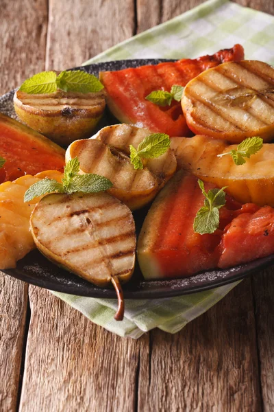 Healthy fruits grilled apples, pears, watermelon and melon with