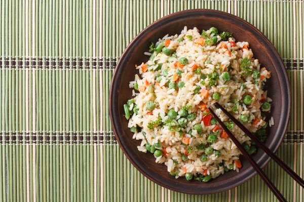 Japanese fried rice with egg and peas top view horizontal