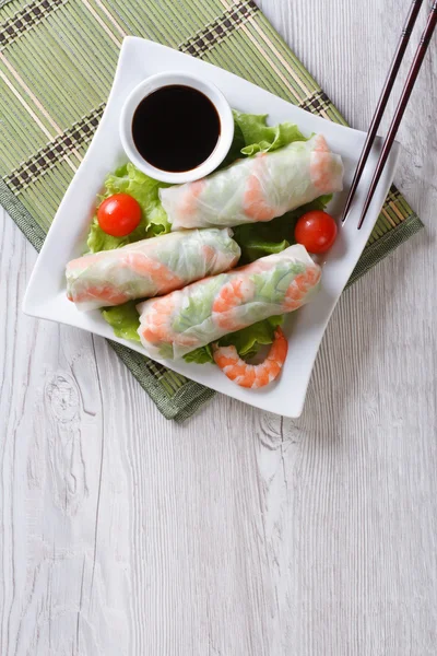 Spring roll with shrimp and sauce top view vertical