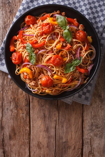Spaghetti with minced and vegetables. vertical top view