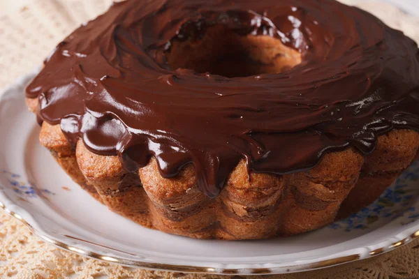 Chocolate cake fancy bread on a plate closeup. Horizontal