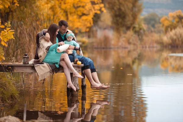 Family resting on the lake