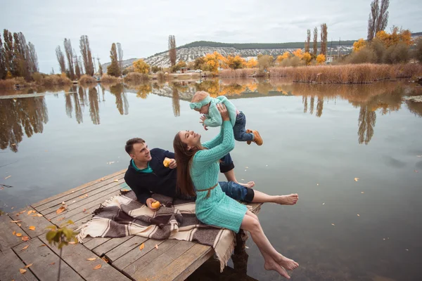 Family resting on the lake