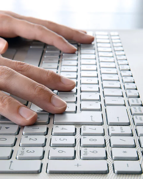 Woman hands typing your computer at work