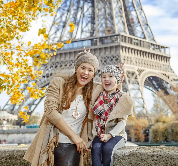 Mother and child travellers having fun time in Paris, France