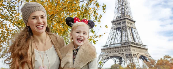 Tourists mother and daughter in Minnie Mouse Ears in Paris