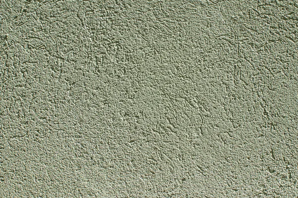 Green colored plaster house wall