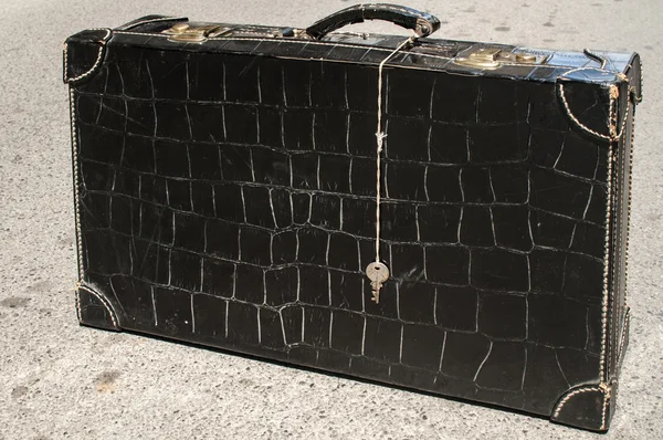 Suitcase of black patent leather