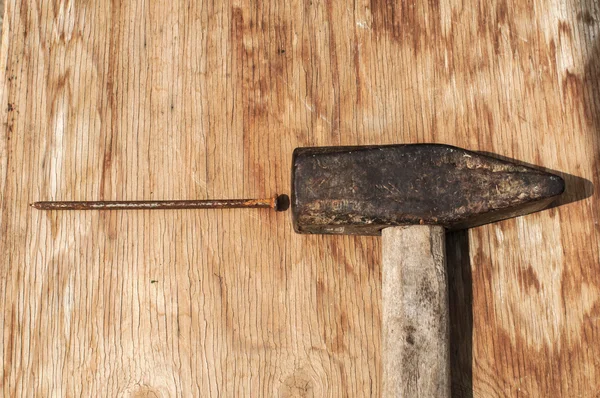 Old hammer and rusty nails