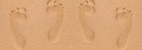Four footprints in sand