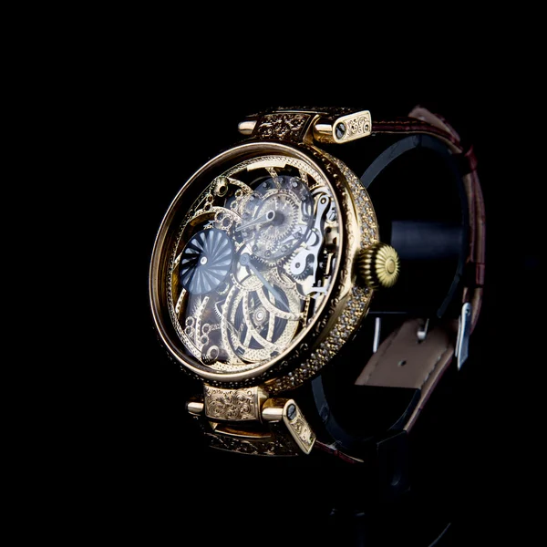 Men's luxury wristwatch on black background