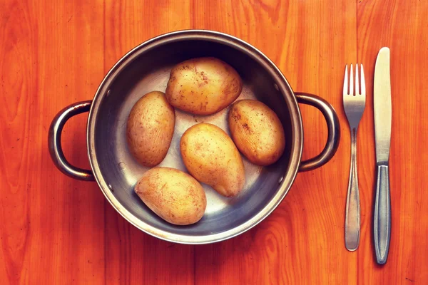 Boiled potatoes in a pan.