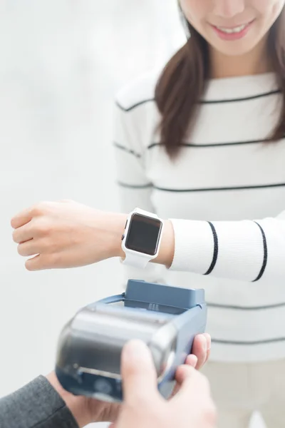 Woman pay by smart watch