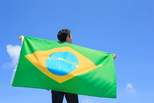Man holding brazilian  flag