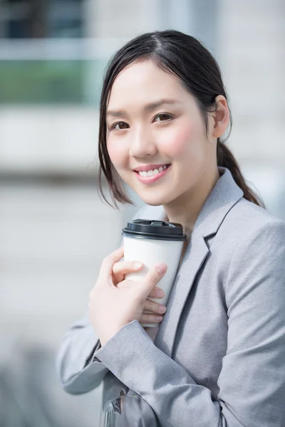 Business woman with coffee cup