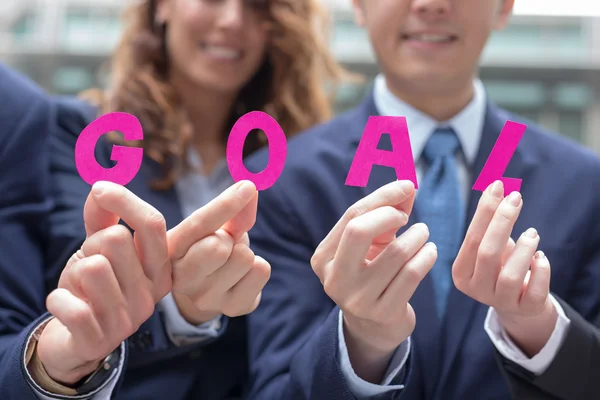 Businesspeople  showing  goal text