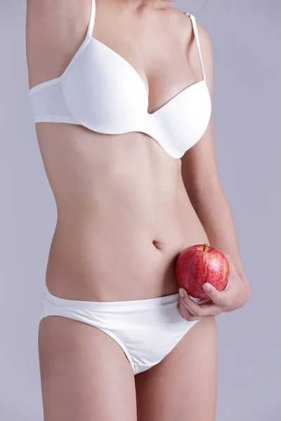 Woman holding  apple