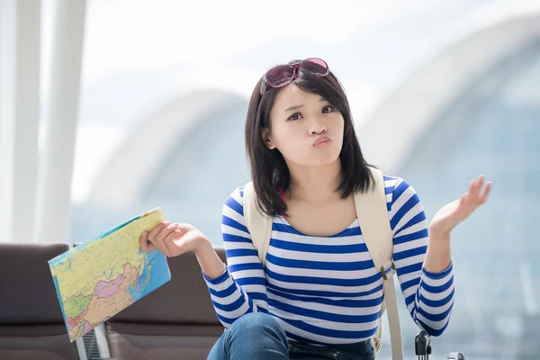 confused woman holding  map