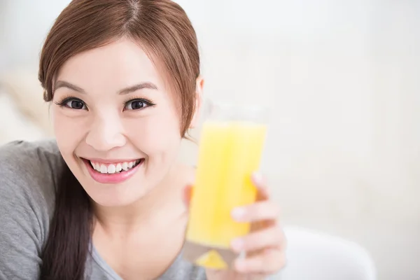 Woman hold orange juice