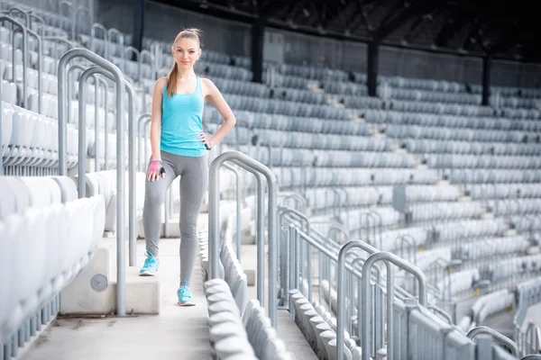 Woman preparing for training on stadium, stairs and fitness training - cross fit workout