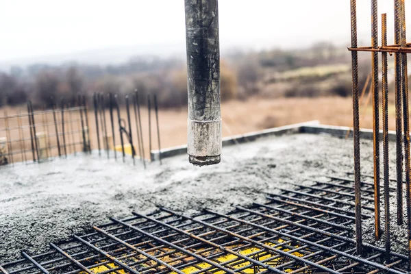 Concrete automatic pump tube working on construction site