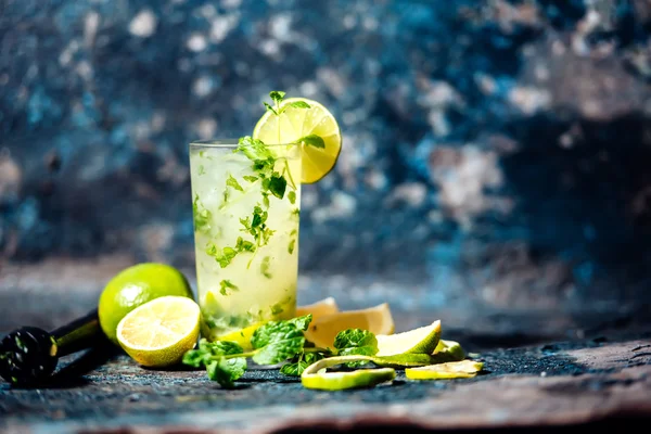 Refreshment cocktail with lime and ice. Mojito drink served at bar, pub or restaurant