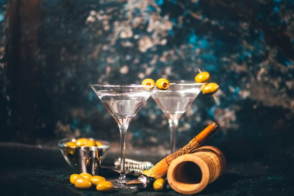 Vodka martini, dry cocktail. Classic martini with olives served cold in restaurant or club. Alcoholic cocktails in local bar. Vintage effect