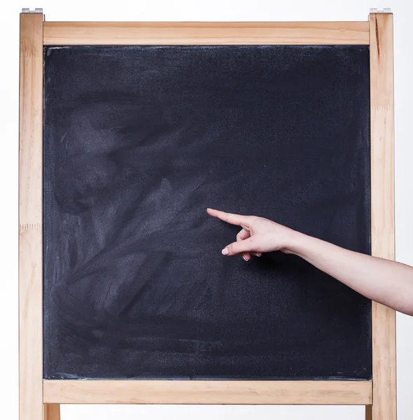 Girl pointing to an empty board