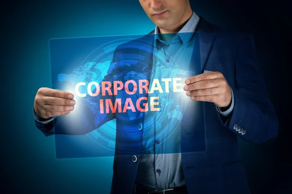 Businessman holding a transparent screen with an inscription a c