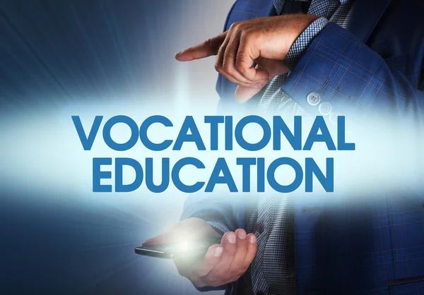 Businessman presses button vocational education on virtual scree