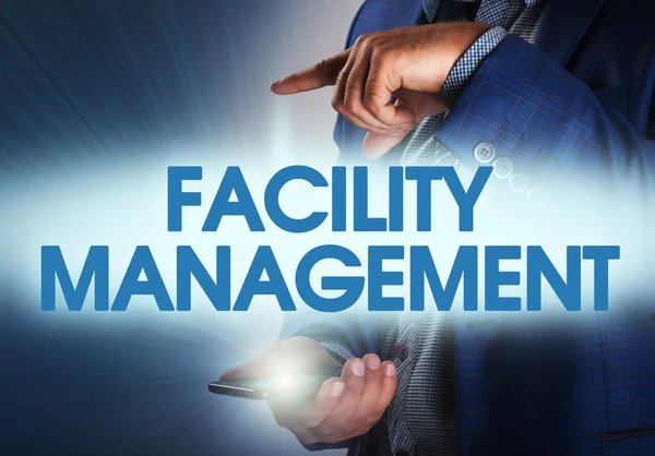 Businessman presses button facility management on virtual screen
