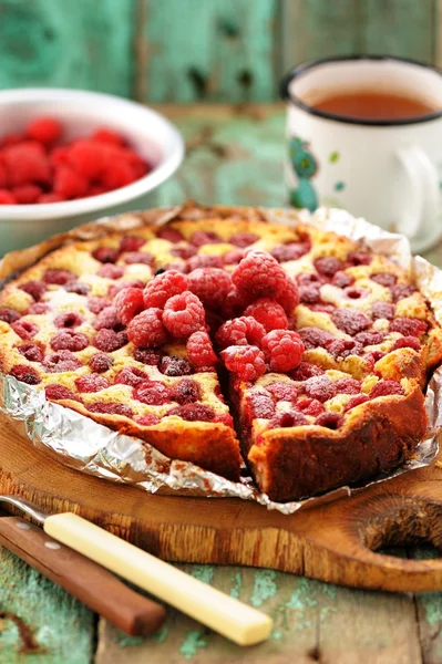 Homemade berry cake with fresh raspberries baked and served in foil