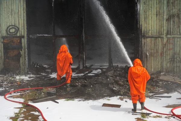 Russian Emergency Control fire drill in orange protective suits