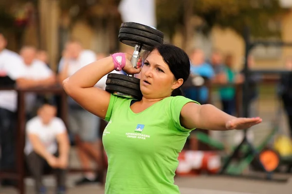 Orel, Russia, September 5, 2015: Woman powerlifter lifts heavy d