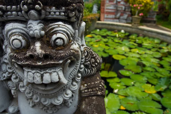Hindu Temple Demon Statue Lily Pad Pond Bali