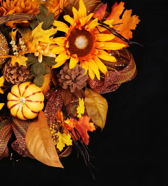 Autumn or Thanksgiving Bouquet over black background. Pumpkin, S