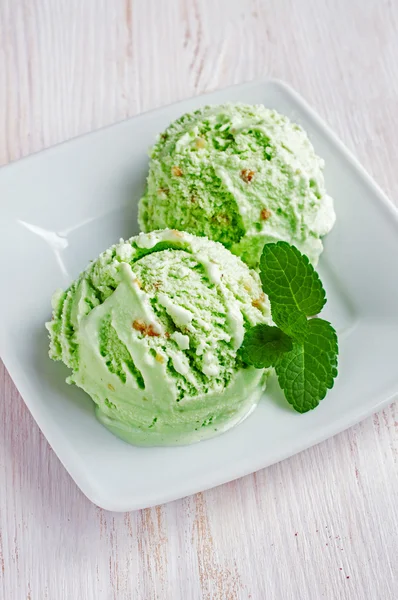 Green pistachio or mint ice cream scoops