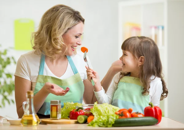 Girl and mother eating