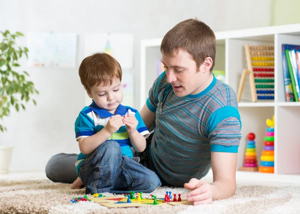 Father with his child girl play together