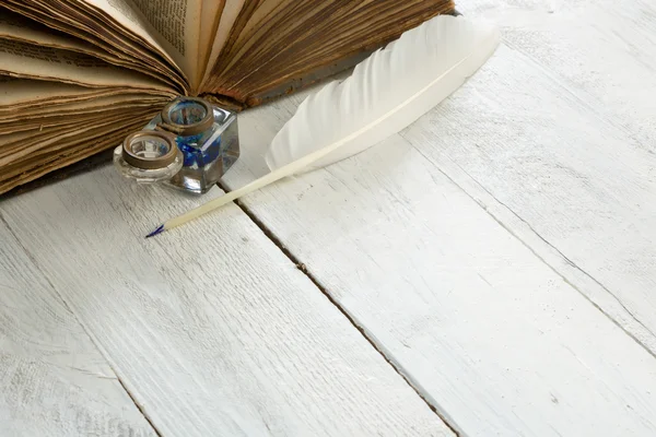 Goose feather and ancient book