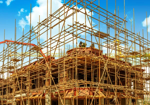 Construction sites, scaffolding and cranes.