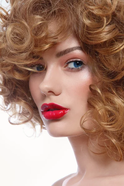 Woman with curly hair and red lipstick